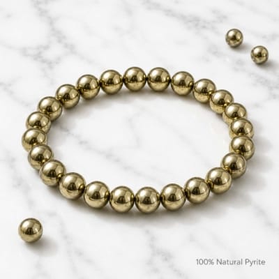 Luxury product photo of Natural Pyrite Bracelet on white marble background with premium polished metallic finish.
