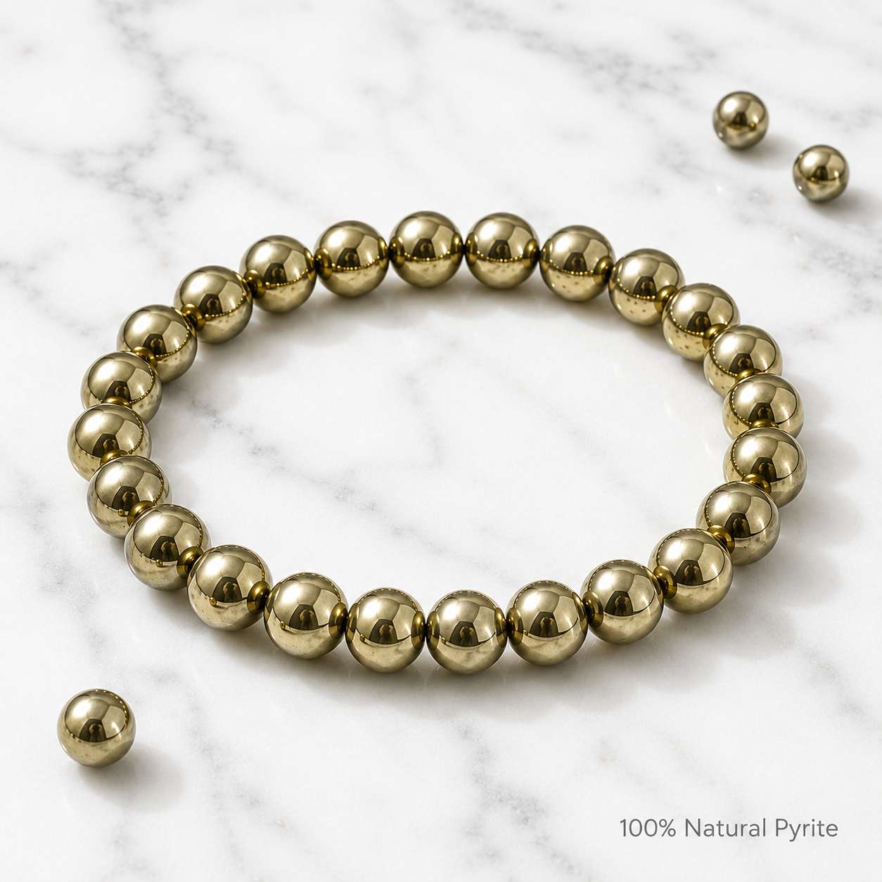 Luxury product photo of Natural Pyrite Bracelet on white marble background with premium polished metallic finish.