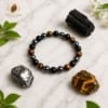 triple-protection-bracelet-white-marble marble.jpg Triple Protection Bracelet on white marble with Black Tourmaline, Tiger Eye and Hematite natural gemstones.