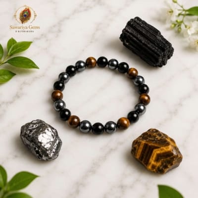 marble.jpg Triple Protection Bracelet on white marble with Black Tourmaline, Tiger Eye and Hematite natural gemstones.