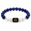 libra-zodiac-bracelet-lapis-lazuli-howlite-white-background Natural Libra Zodiac Bracelet featuring Lapis Lazuli, Howlite and gold Libra symbol bead, 8mm natural gemstone bracelet on a clean white background.